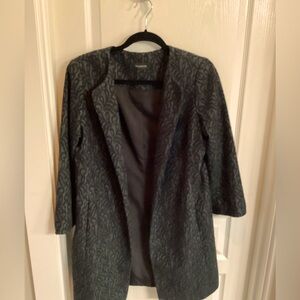 Stylish, above the knee, black and teal brocade multi-functional career jacket.